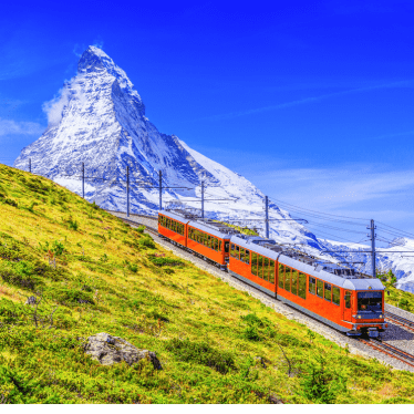 train heading toward Matterhorn mountain in Switzerland