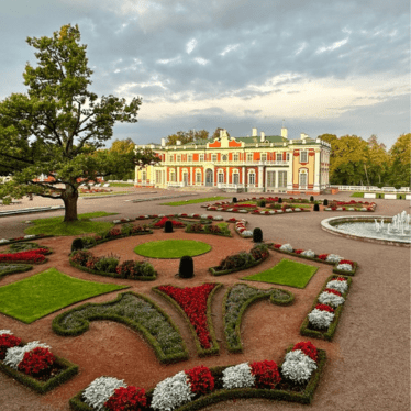 Beautiful museum with red and green trim and large surrounding gardens in Tallinn Estonia