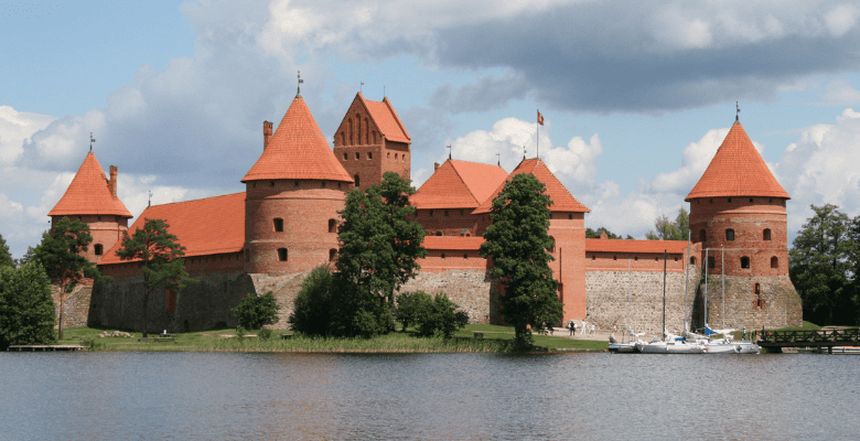 Castle with red roof on an island in Lithuania