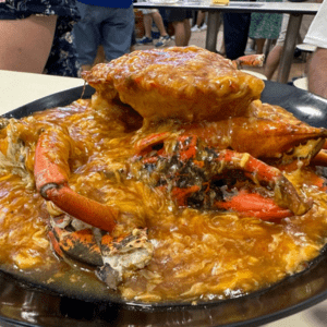dish with whole crab and sauce