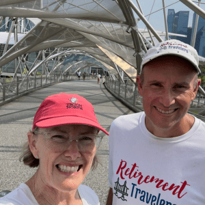 John and Bev Retirement Travelers standing on Helix Bridge in Singapore