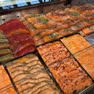 trays of salmon displayed at a public market
