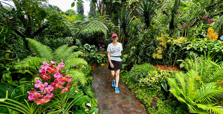 Bev walking on a path in The National Orchid Garden of Singapore