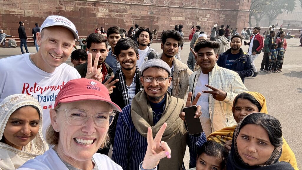 group of people posing for a picture outside Red Fort in Delhi