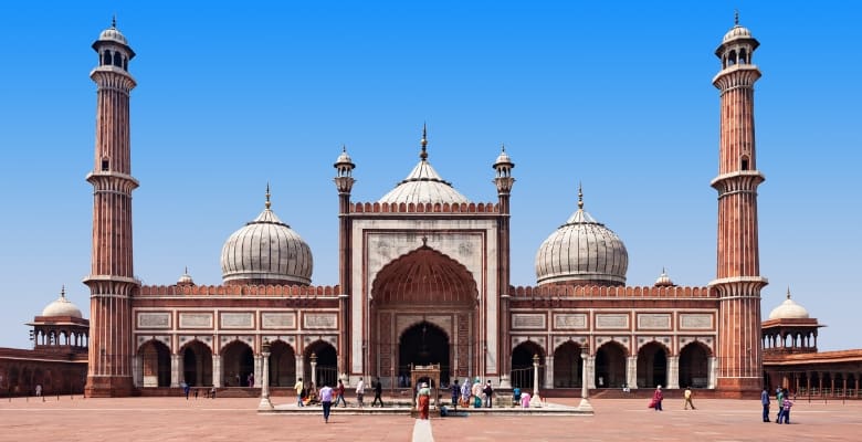 Beautiful tan colored mosque with 2 tall minerets in india