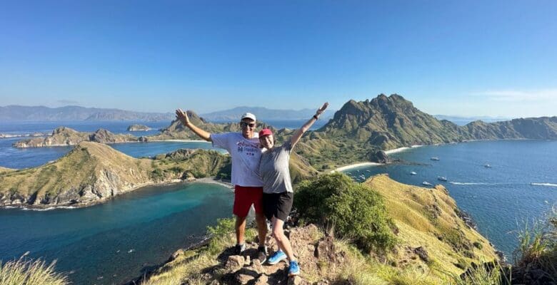 Retirement Travelers on top of mountain overlooking Komodo National Park