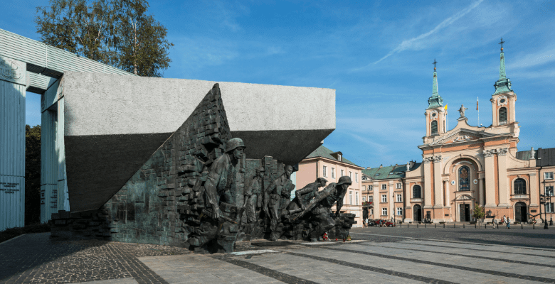 Museum in Warsaw with sculptures outside building in concrete open area
