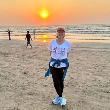 Bev standing on the beach at sunset in Mumbai