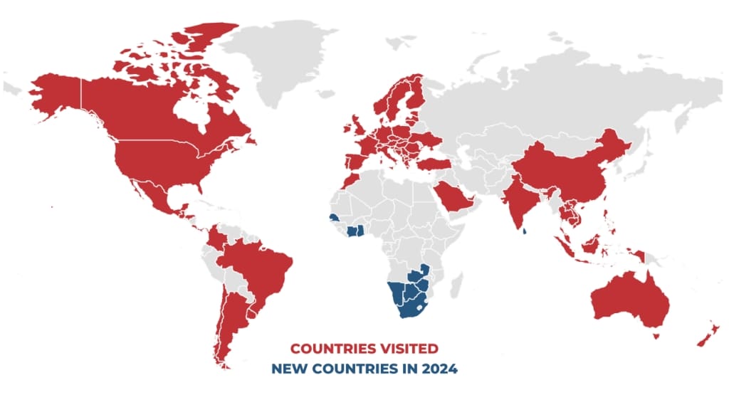 A red and blue map of the world showing where the Retirement Travelers have been and where they are going in 2024.