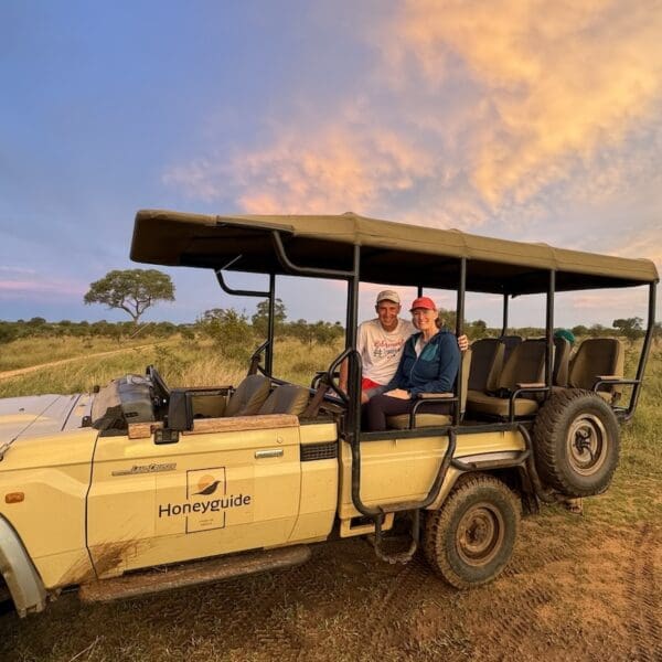 A safari jeep with John & Bev sitting in the back.