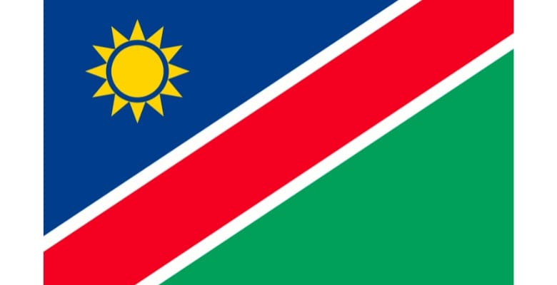 Blue, red, green flag with a yellow sun in upper left corner