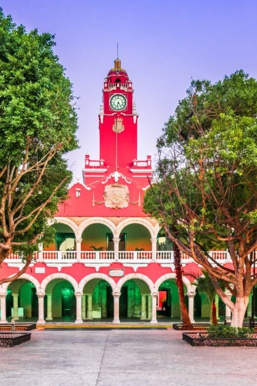 red clock tower in dowtown Merida Mexico