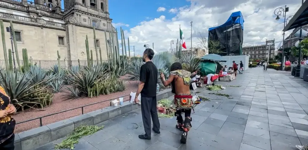 A visitor getting a cleansing with smoke.