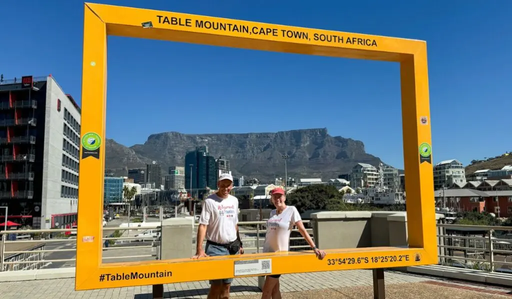 john and bev in a frame photograph with table mountain in background