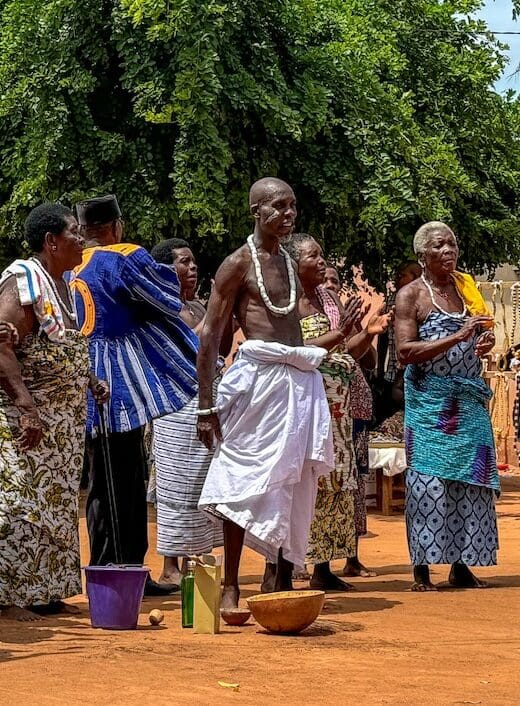 A group of men and women welcoming us to their village.