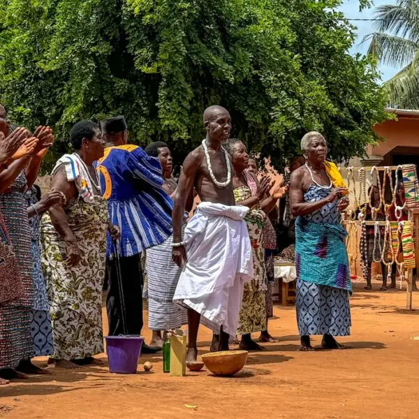 A group of men and women welcoming us to their village.