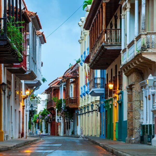 colorful colonias homes in Cartegena, colombia with street lights on