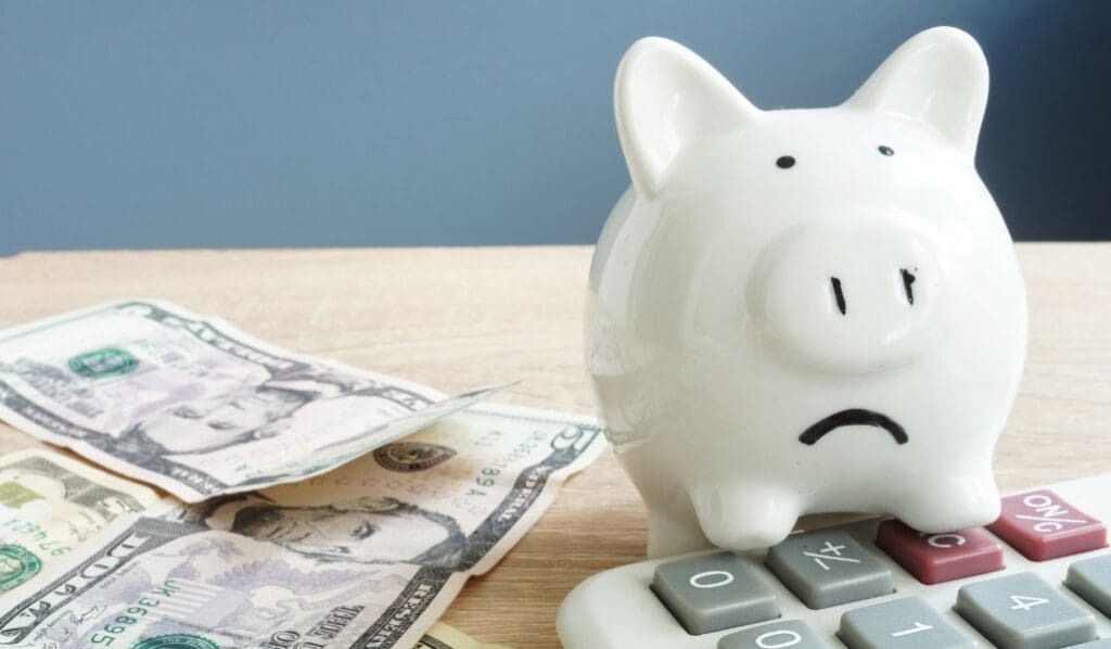 piggy bank with cash on a table