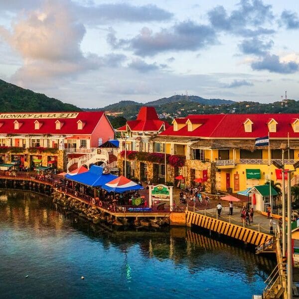 Honduras town on water at dusk with lights on