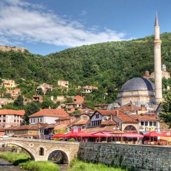 Kosovo city of Prizren with mosque in town and fortress on hill