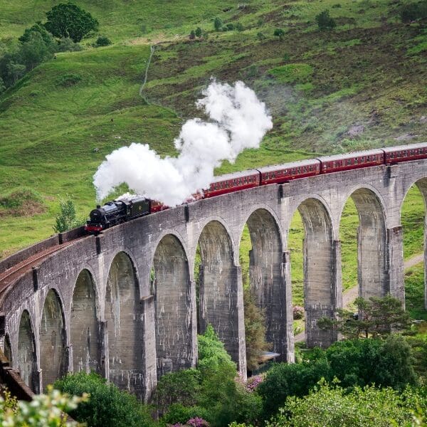 train and bridge in scotland countryside