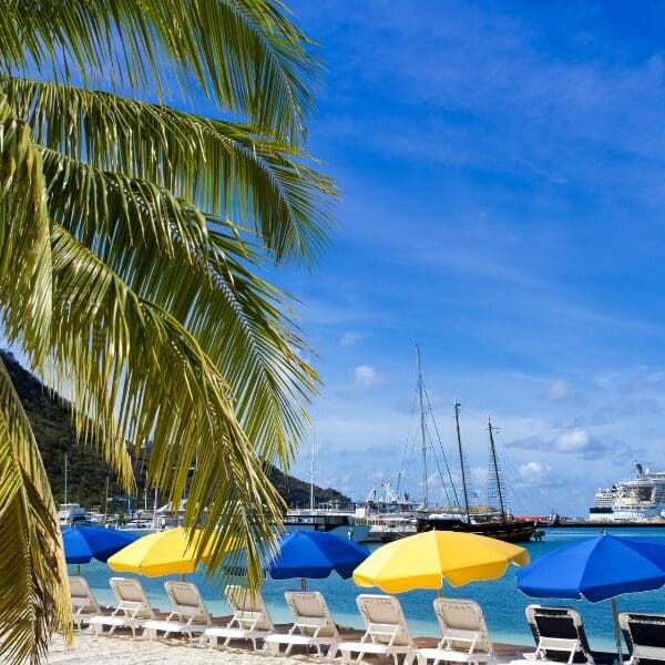 beach umbrellas by ocean in st. maarten