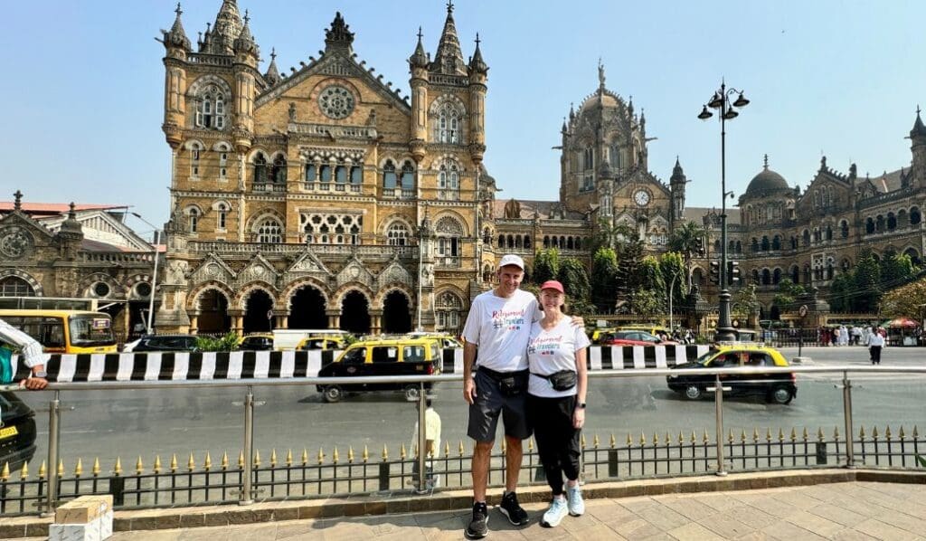 Retirement Travelers standing in front of Chhatrapati Shivaji Terminus