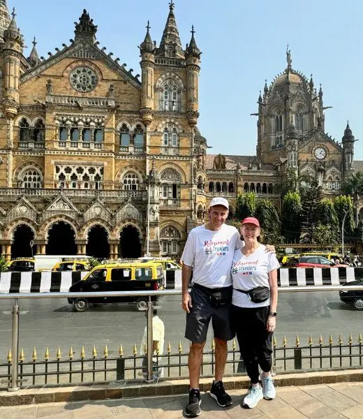 Retirement Travelers standing in front of Chhatrapati Shivaji Terminus