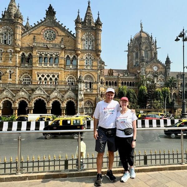 Retirement Travelers standing in front of Chhatrapati Shivaji Terminus