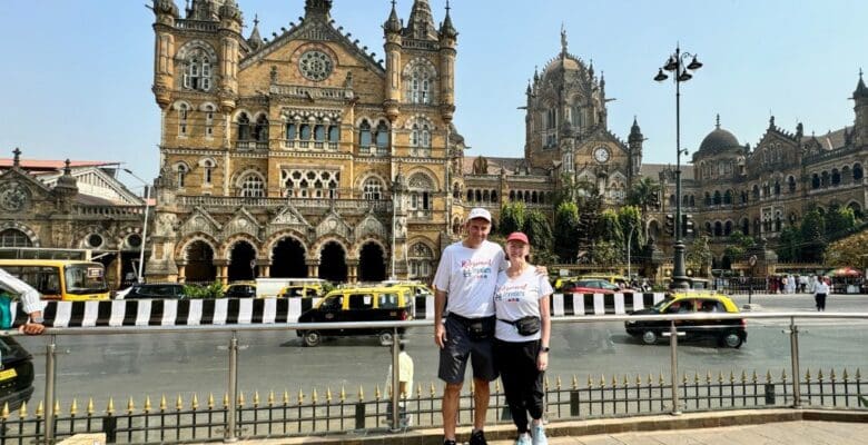 Retirement Travelers standing in front of Chhatrapati Shivaji Terminus