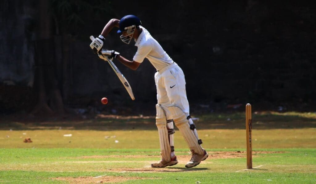 cricket player getting ready to swing the racket