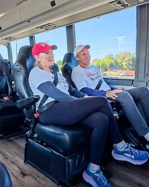 john and bev retirement travelers sitting in jet bus