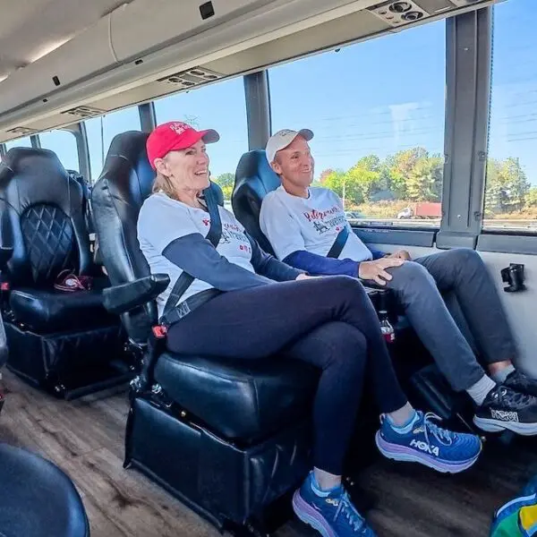 john and bev retirement travelers sitting in jet bus